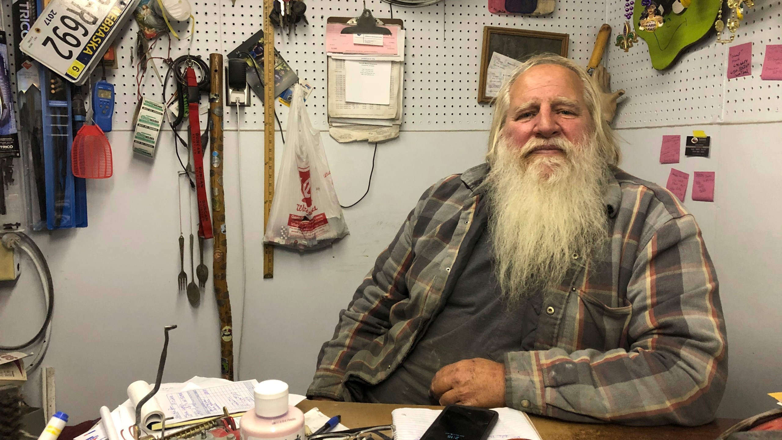 Danny Rice, 67, discusses the coronavirus in his auto repair shop in downtown Elmwood, Nebraska, on Monday, Nov. 9, 2020. (Grant Schulte/AP Photo)