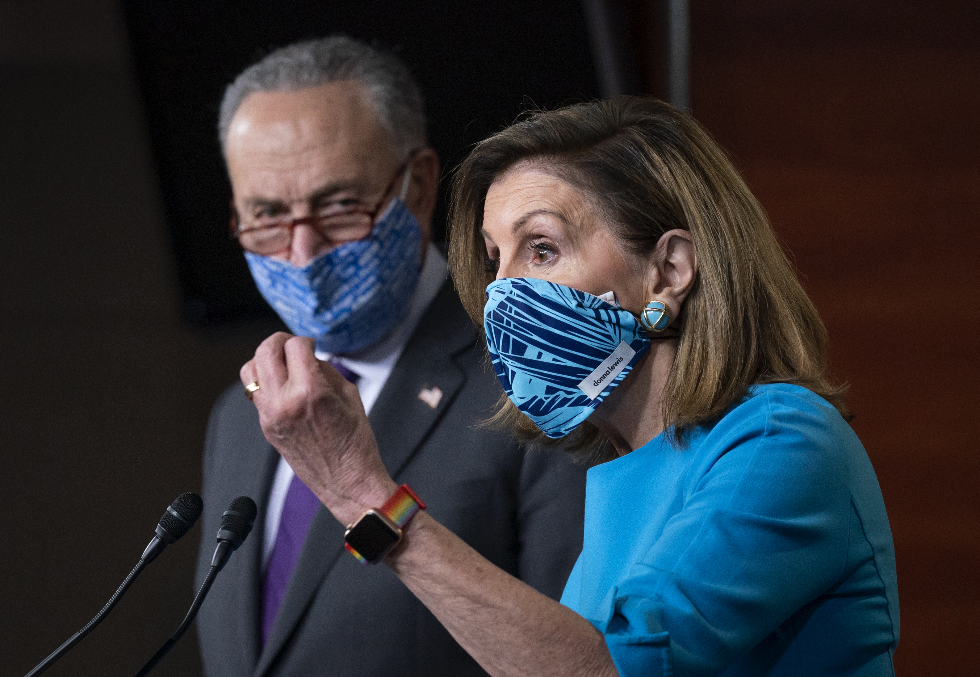 Speaker of the House Nancy Pelosi, D-Calif., and Senate Minority Leader Chuck Schumer, D-N.Y., left, meet with reporters on Capitol Hill in Washington, Thursday, Nov. 12, 2020. (AP Photo/J. Scott Applewhite)