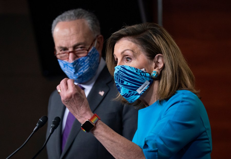 Speaker of the House Nancy Pelosi, D-Calif., and Senate Minority Leader Chuck Schumer, D-N.Y., left, meet with reporters on Capitol Hill in Washington, Thursday, Nov. 12, 2020. (AP Photo/J. Scott Applewhite)