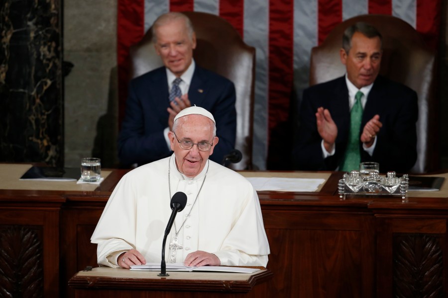 In this Sept. 24, 2015, file photo, Pope Francis addresses a joint meeting of Congress on Capitol Hill, making history as the first pontiff to do so. Listening behind the pope are Vice President Joe Biden and House Speaker John Boehner of Ohio. (Carolyn Kaster / Associated Press)