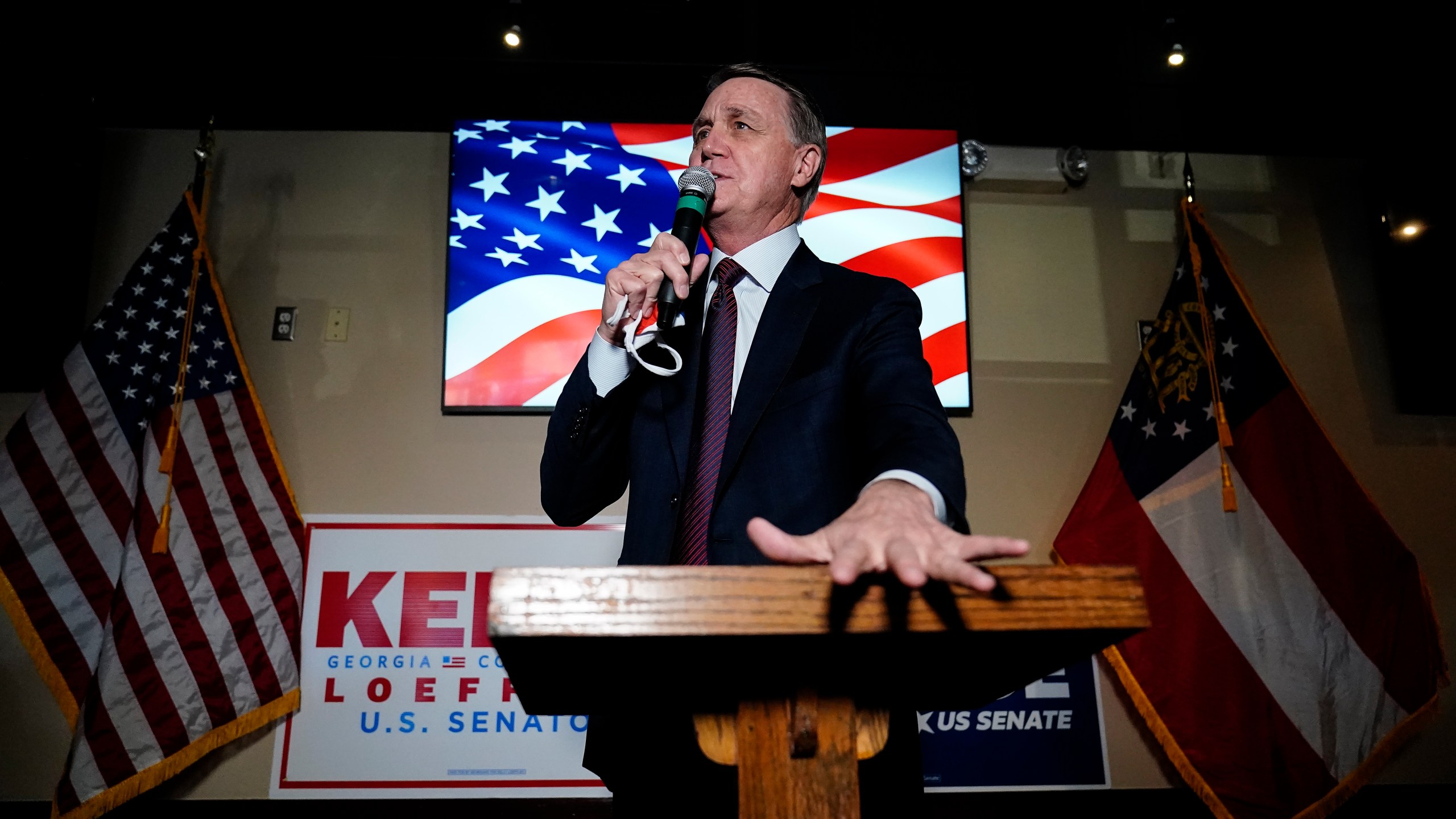 Republican candidate for U.S. Senate Sen. David Perdue speaks during a campaign rally on Friday, Nov. 13, 2020, in Cumming, Ga. Perdue and Democratic candidate Jon Ossoff are in a runoff election for the Senate seat in Georgia. (AP Photo/Brynn Anderson)