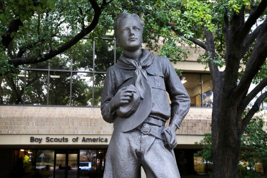 In this Feb. 12, 2020 file photo, a statue stands outside the Boys Scouts of America headquarters in Irving, Texas. Close to 90,000 sex-abuse claims have been filed against the Boy Scouts of America as the deadline arrived Monday, Nov. 16 for filing claims in the BSA’s bankruptcy case. The number far exceeded initial projections of lawyers across the United States who have been signing up clients in the case since the Boy Scouts filed for bankruptcy protection in February in the face of hundreds of lawsuits. (AP Photo/LM Otero, File)