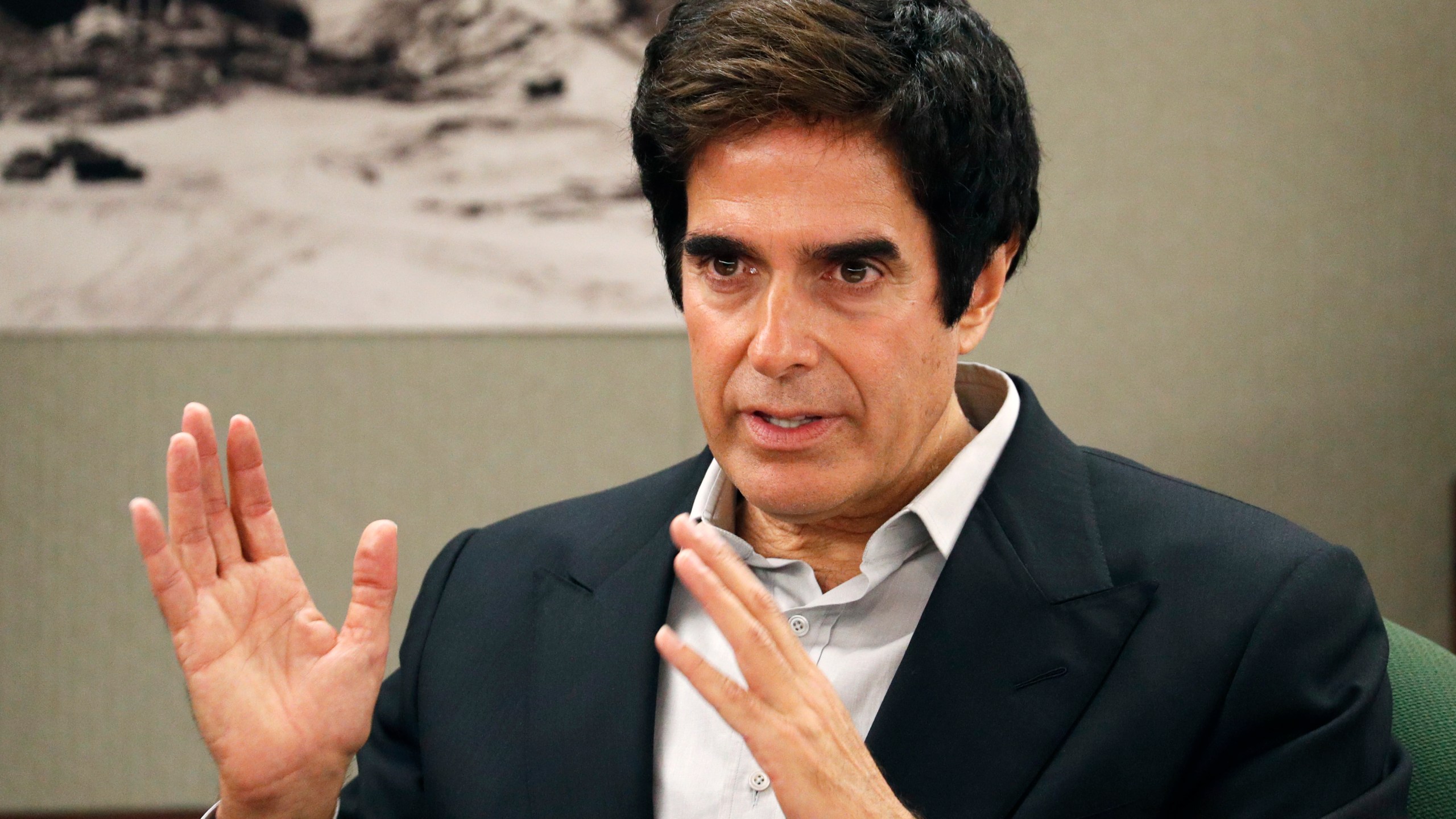 In this April 24, 2018, file photo, illusionist David Copperfield appears in court in Las Vegas. Copperfield is suspending his Las Vegas stage show in the wake of a crew member testing positive for COVID-19. (John Locher/AP Photo)