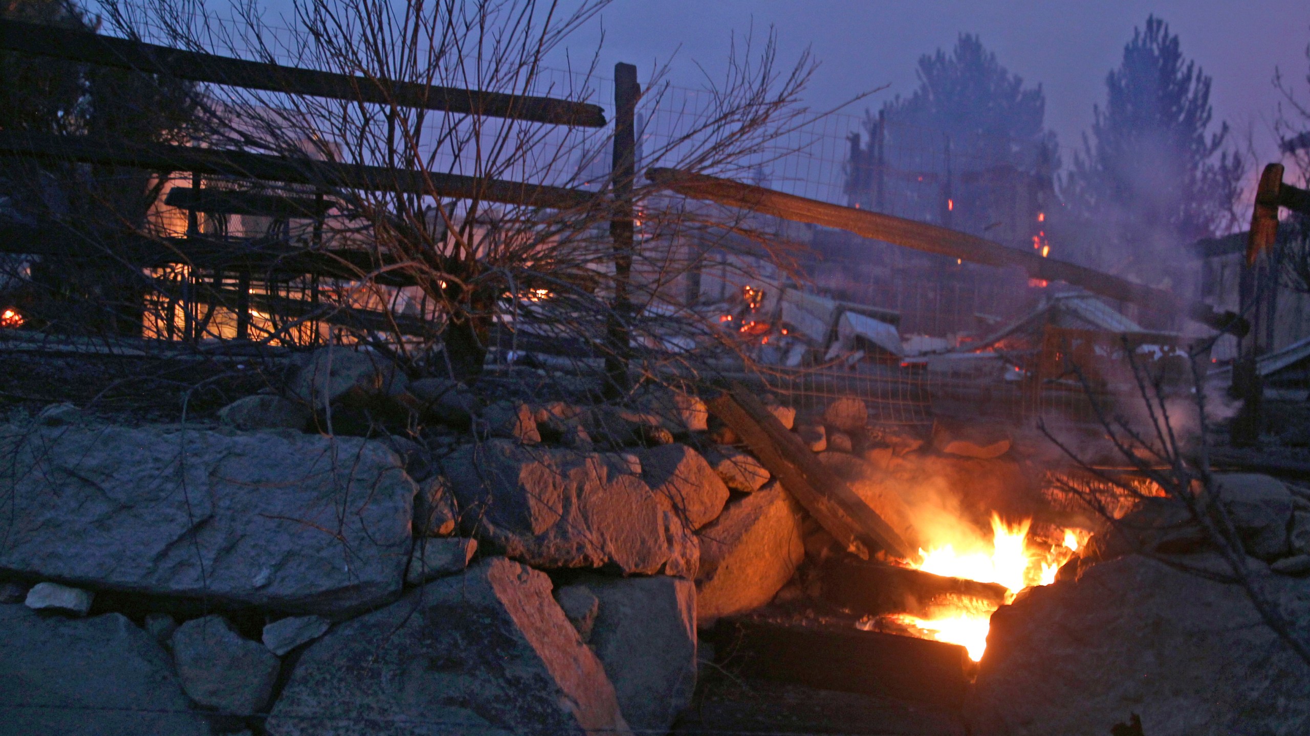 Wooden steps burn after wildfires in southwest Reno destroyed several homes in the Juniper Hills area on Nov.17, 2020. (Lance Iversen / Associated Press)