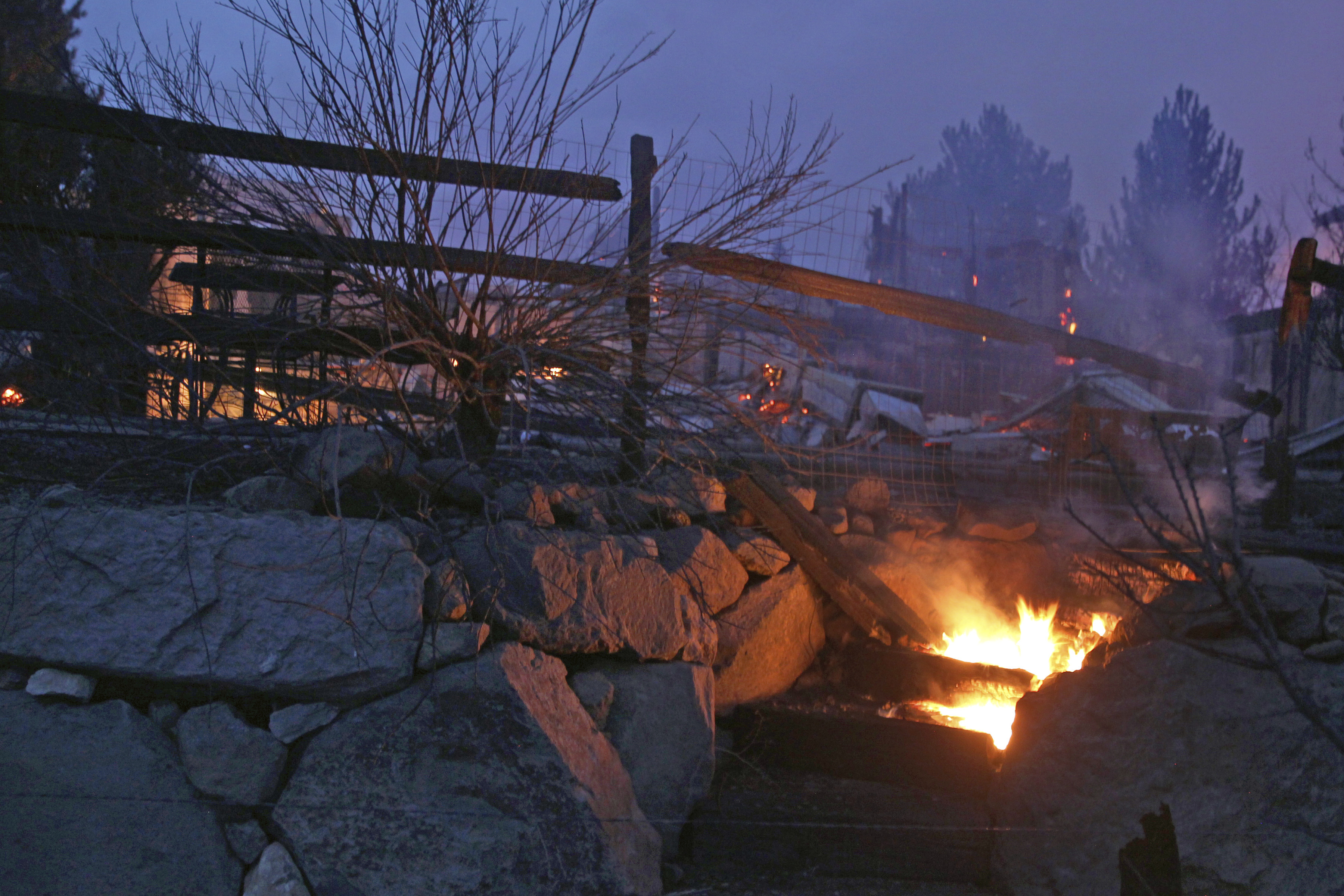 Wooden steps burn after wildfires in southwest Reno destroyed several homes in the Juniper Hills area on Nov.17, 2020. (Lance Iversen / Associated Press)