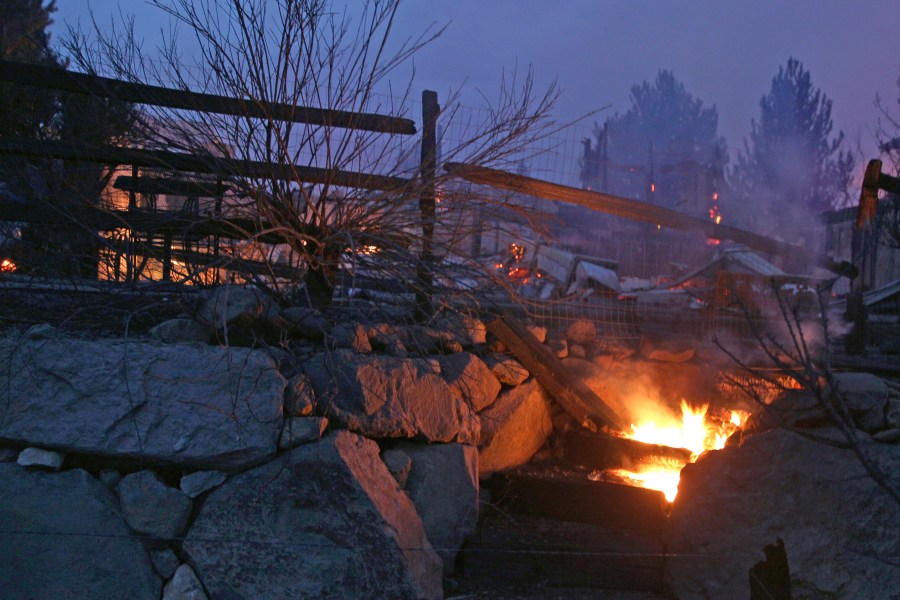 Wooden steps burn after wildfires in southwest Reno destroyed several homes in the Juniper Hills area on Nov.17, 2020. (Lance Iversen / Associated Press)