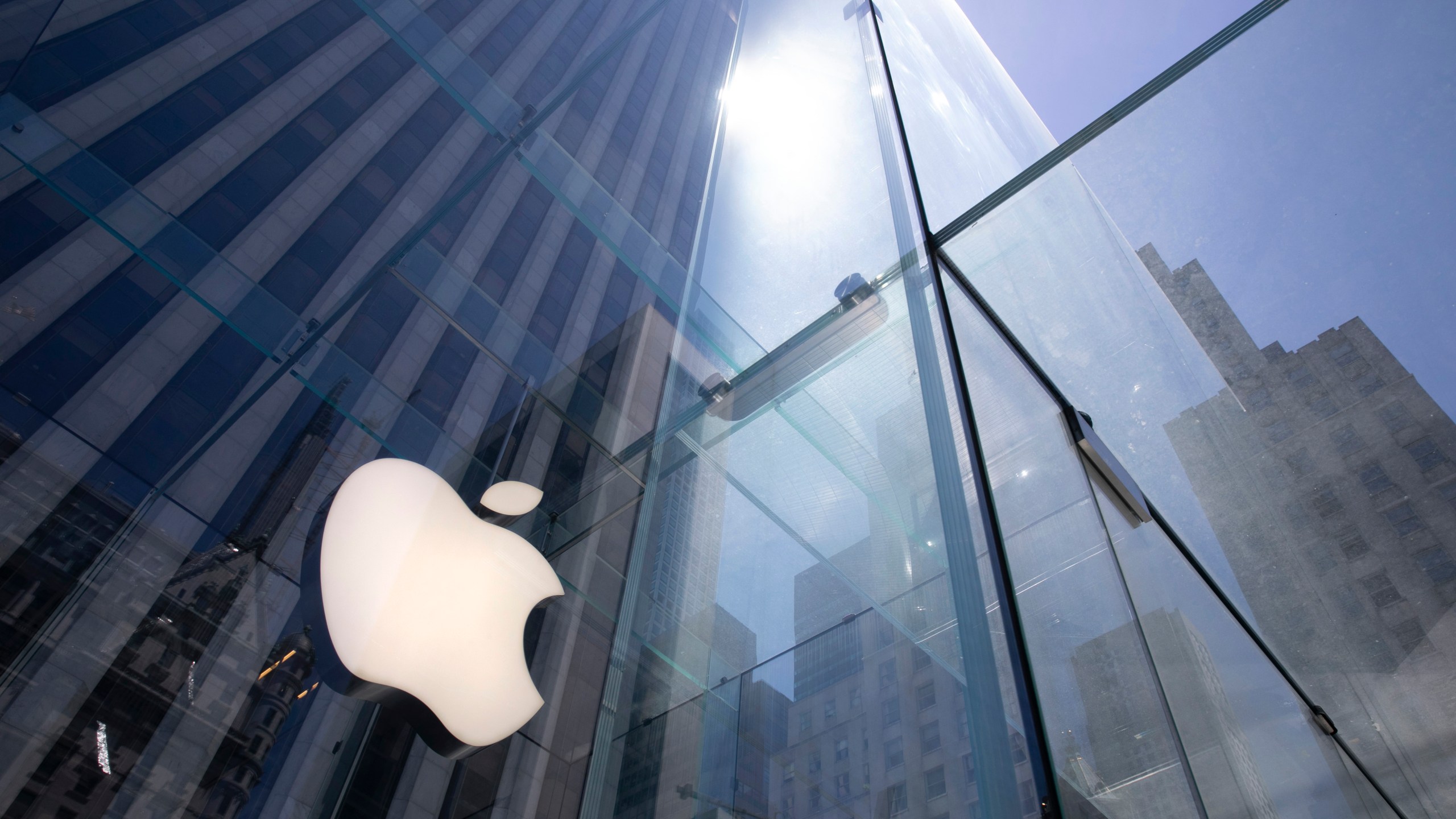 In this June 16, 2020, file photo, the sun is reflected on Apple's Fifth Avenue store in New York. (Mark Lennihan/AP Photo)