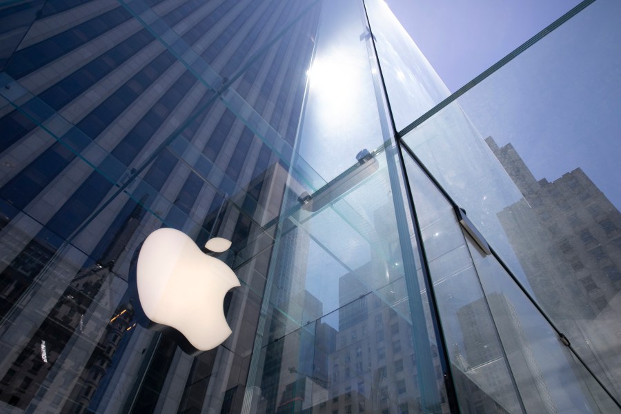 In this June 16, 2020, file photo, the sun is reflected on Apple's Fifth Avenue store in New York. (Mark Lennihan/AP Photo)