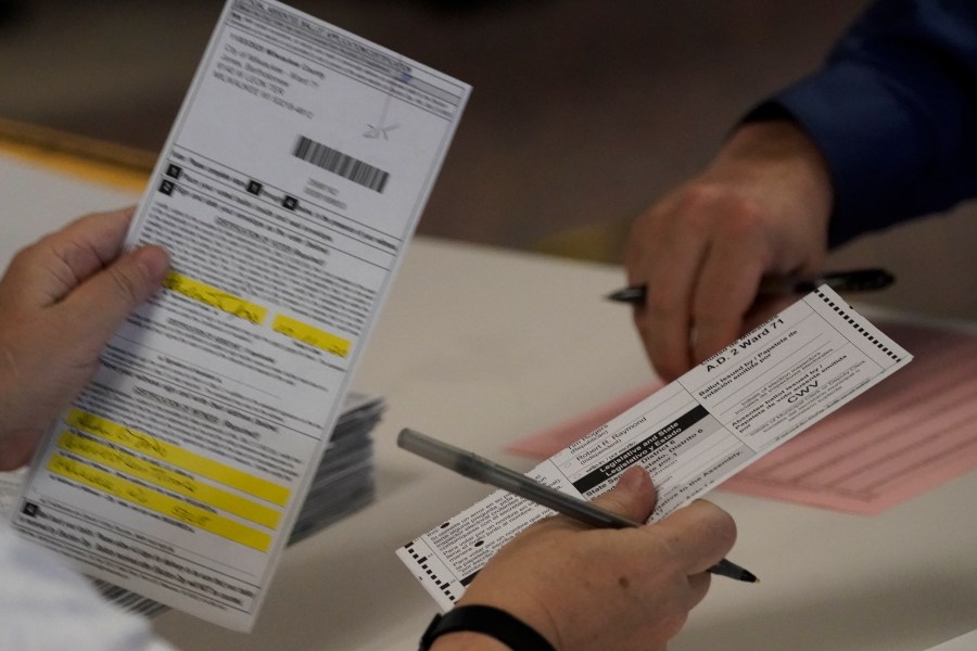 In this Nov. 3, 2020 file photo, workers count Milwaukee County ballots on Election Day at Central Count in Milwaukee. President Donald Trump's campaign has paid $3 million for a recount of two heavily Democratic Wisconsin counties, saying Wednesday, Nov. 18, 2020, that they were the site of the "worst irregularities" although no evidence of wrongdoing has been presented and state elections officials have said there was none. (AP Photo/Morry Gash File)