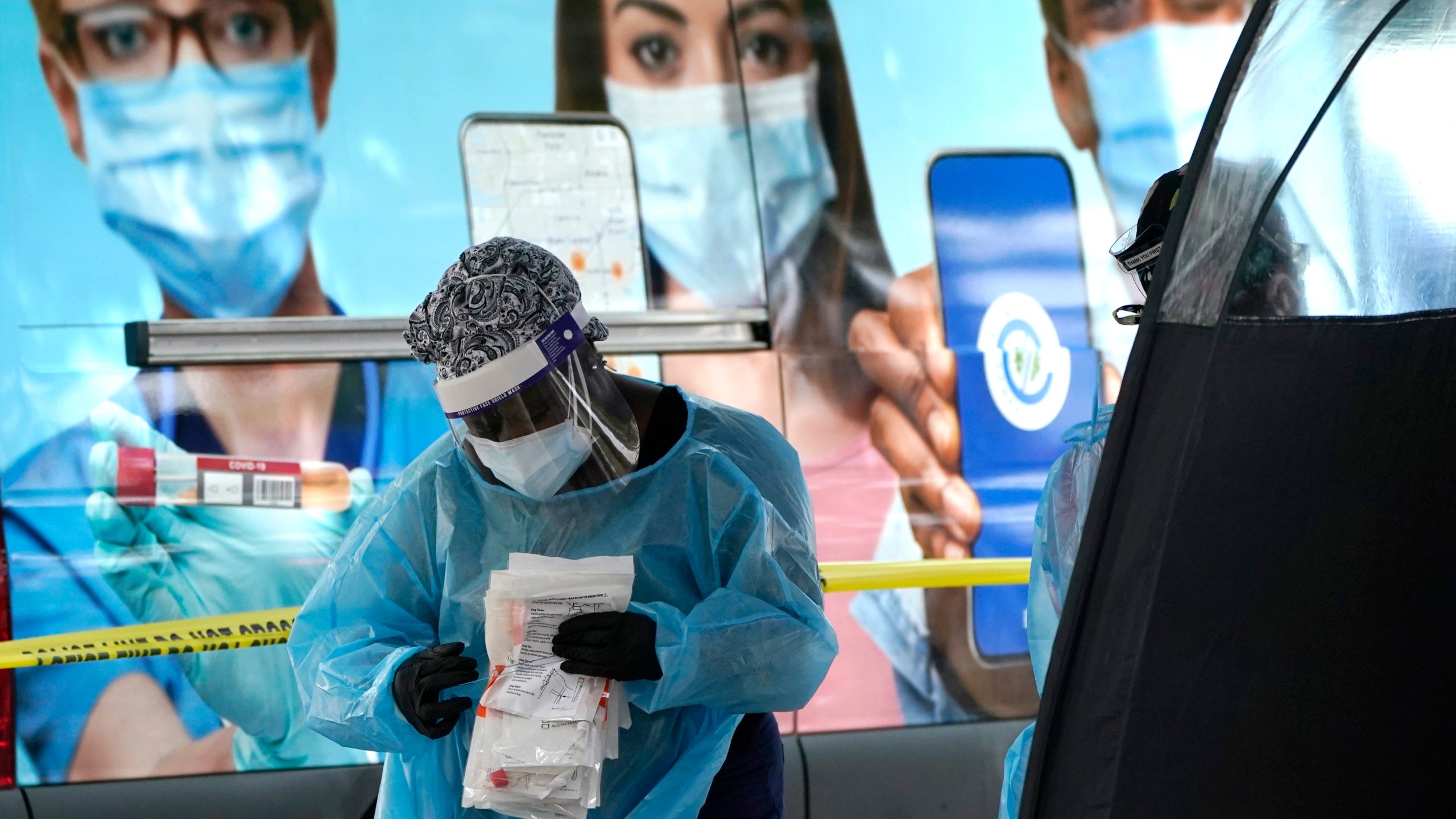 A health care employee works at a walk-up COVID-19 testing site in Miami on Nov. 18, 2020. (Lynne Sladky/Associated Press)