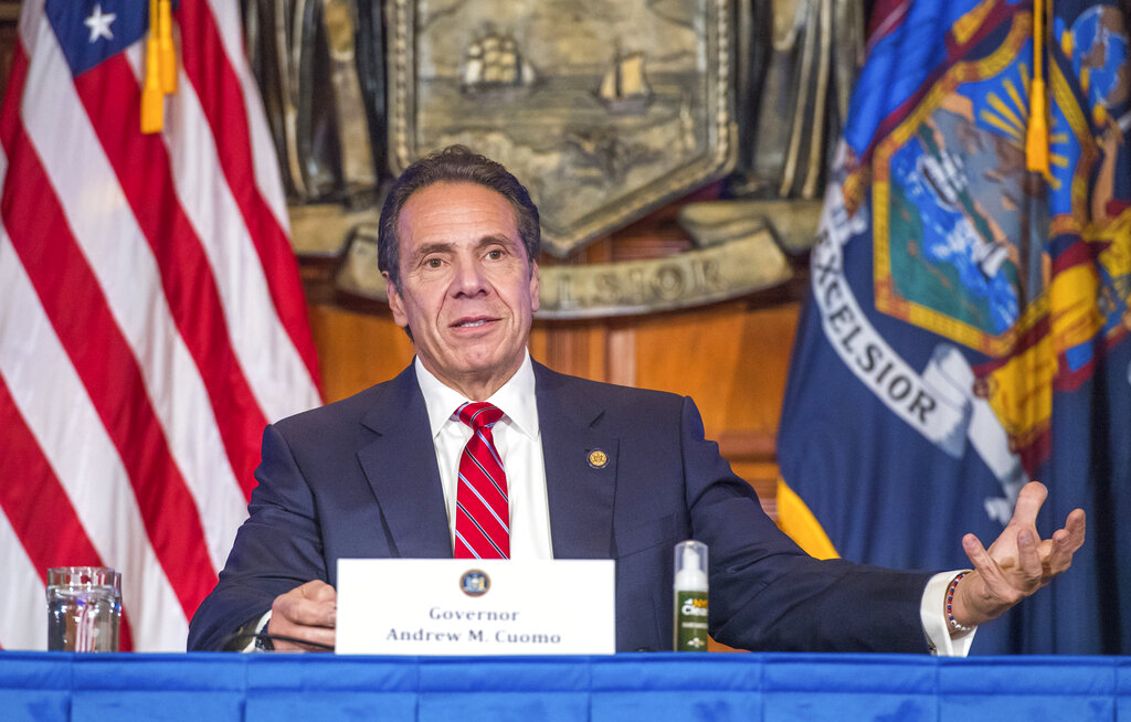 In this Wednesday, Nov. 18, 2020 photo provided by the Office of Governor Andrew M. Cuomo, Gov. Cuomo holds a press briefing on the coronavirus in the Red Room at the State Capitol in Albany, N.Y. (Darren McGee/Office of Governor Andrew M. Cuomo via AP)