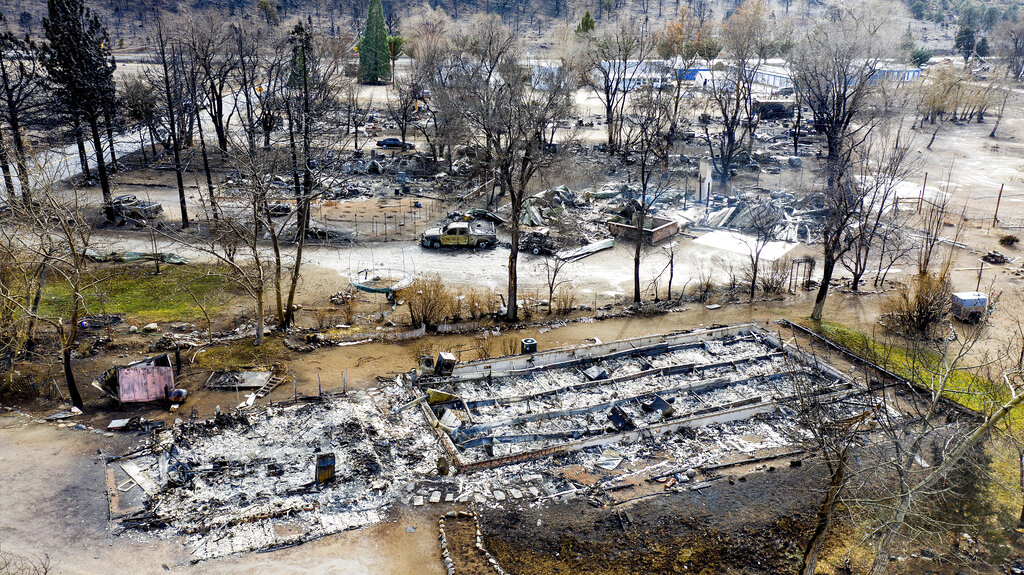 In this photo taken by a drone, homes destroyed by the Mountain View Fire are seen in the Walker community in Mono County on Nov. 18, 2020. (AP Photo/Noah Berger)