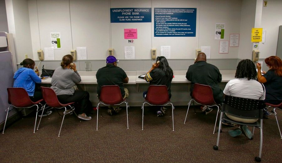 In this Sept. 20, 2013, file photo, visitors use the Unemployment Insurance phone bank at the California Employment Development Department, EDD office in Sacramento, Calif. (Rich Pedroncelli / Associated Press)