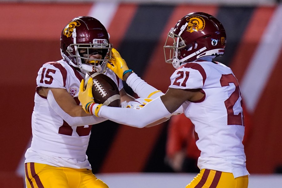 Southern California's Tyler Vaughns (21) celebrates his touchdown against Utah with Drake London (15) during the first half of an NCAA college football game on Nov. 21, 2020, in Salt Lake City. (AP Photo/Rick Bowmer)