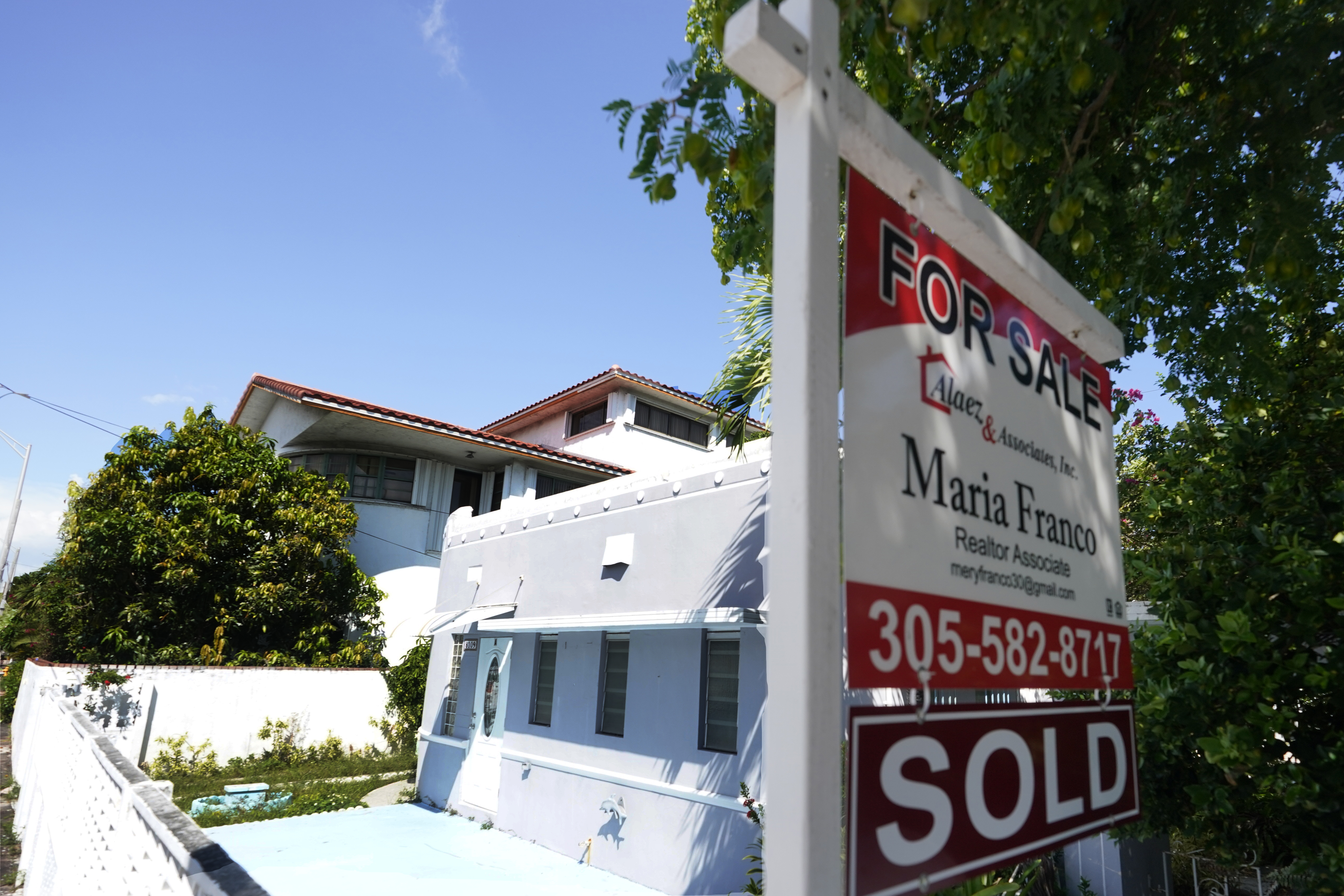 A home for sale with a "sold" sign attached is viewed Monday, Oct. 12, 2020, in Miami Beach, Fla. (AP Photo/Wilfredo Lee)