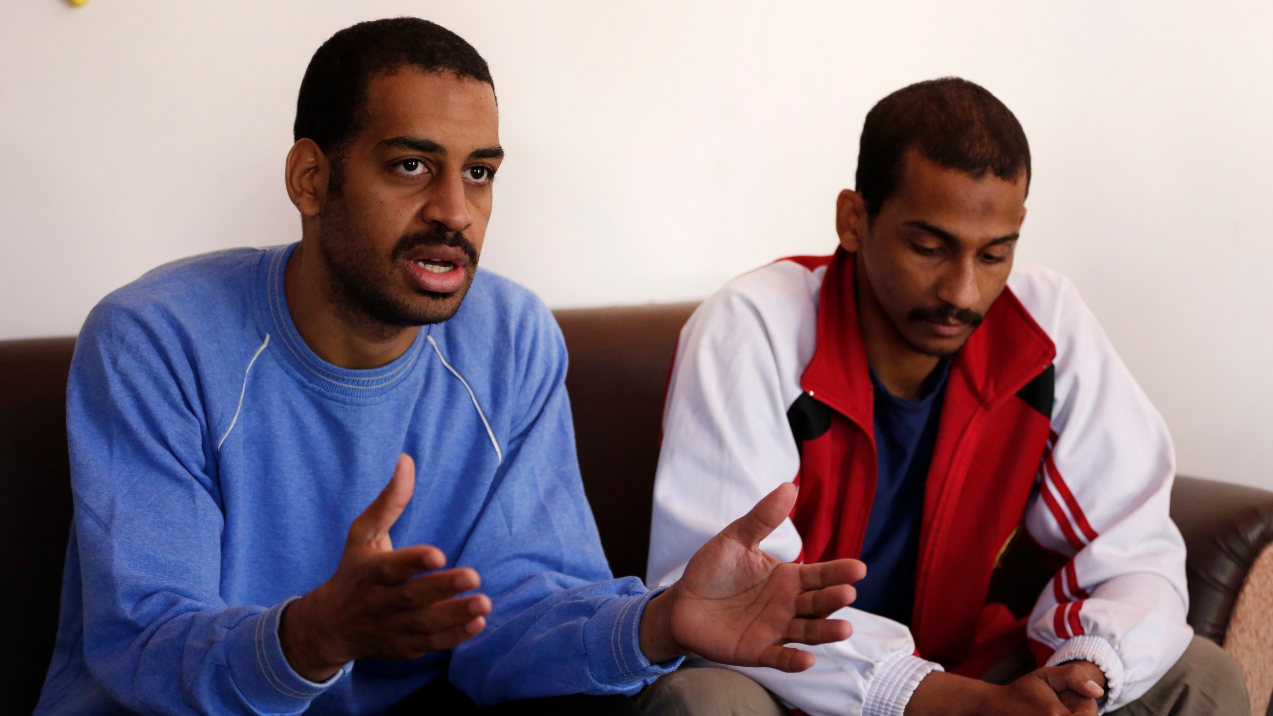 In this March 30, 2019, file photo, Alexanda Amon Kotey, left, and El Shafee Elsheikh, who were allegedly among four British jihadis who made up a brutal Islamic State cell dubbed "The Beatles," speak during an interview with The Associated Press at a security center in Kobani, Syria. (Hussein Malla/AP Photo)