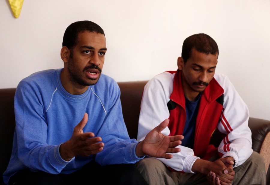 In this March 30, 2019, file photo, Alexanda Amon Kotey, left, and El Shafee Elsheikh, who were allegedly among four British jihadis who made up a brutal Islamic State cell dubbed "The Beatles," speak during an interview with The Associated Press at a security center in Kobani, Syria. (Hussein Malla/AP Photo)