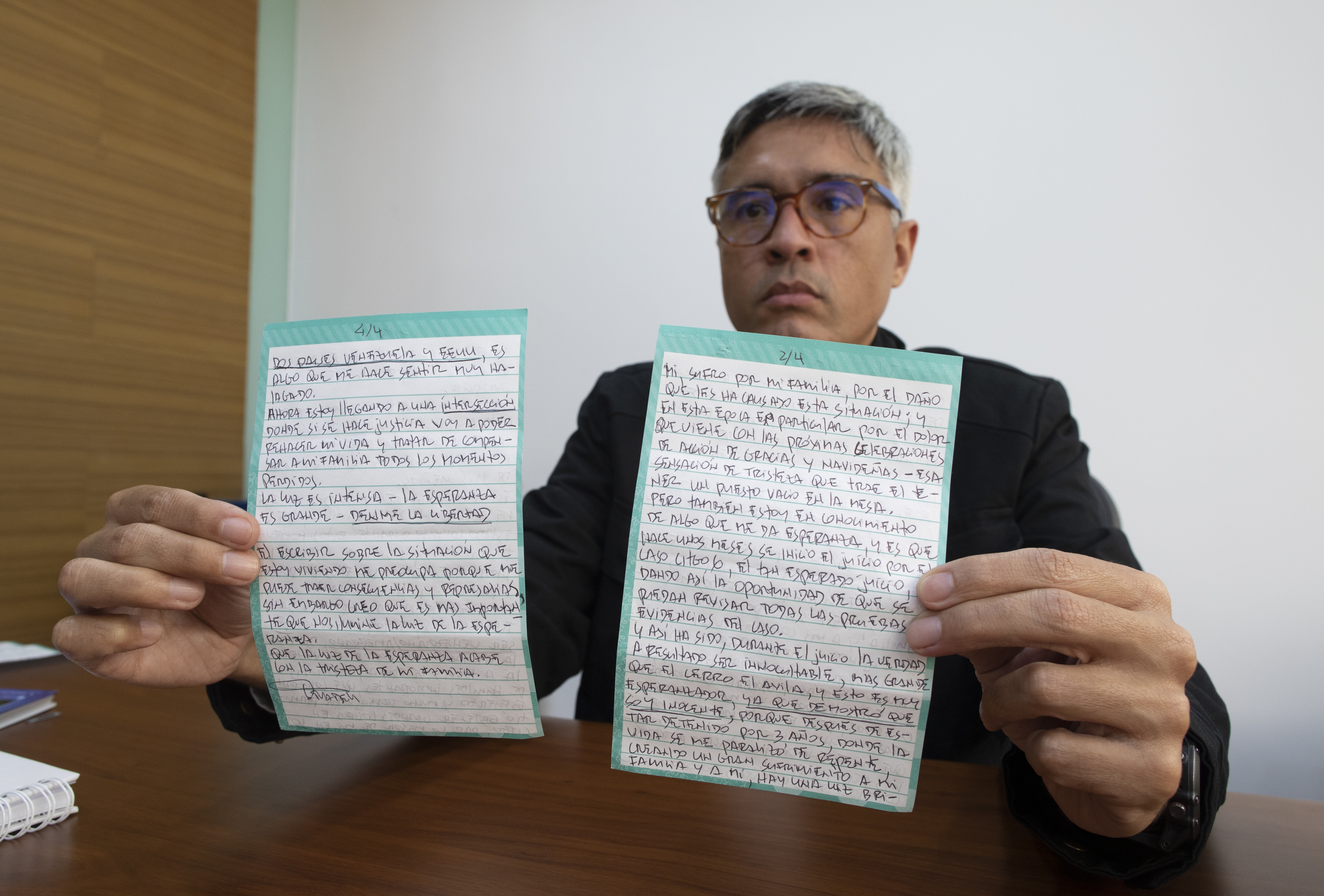 Jesus Loreto, an attorney representing Tomeu Vadell, one of six U.S. oil executives jailed for three years in Venezuela, shows a letter written by Vadell, in Caracas, Venezuela, Wednesday, Nov. 25, 2020. (Ariana Cubillos/AP Photo)