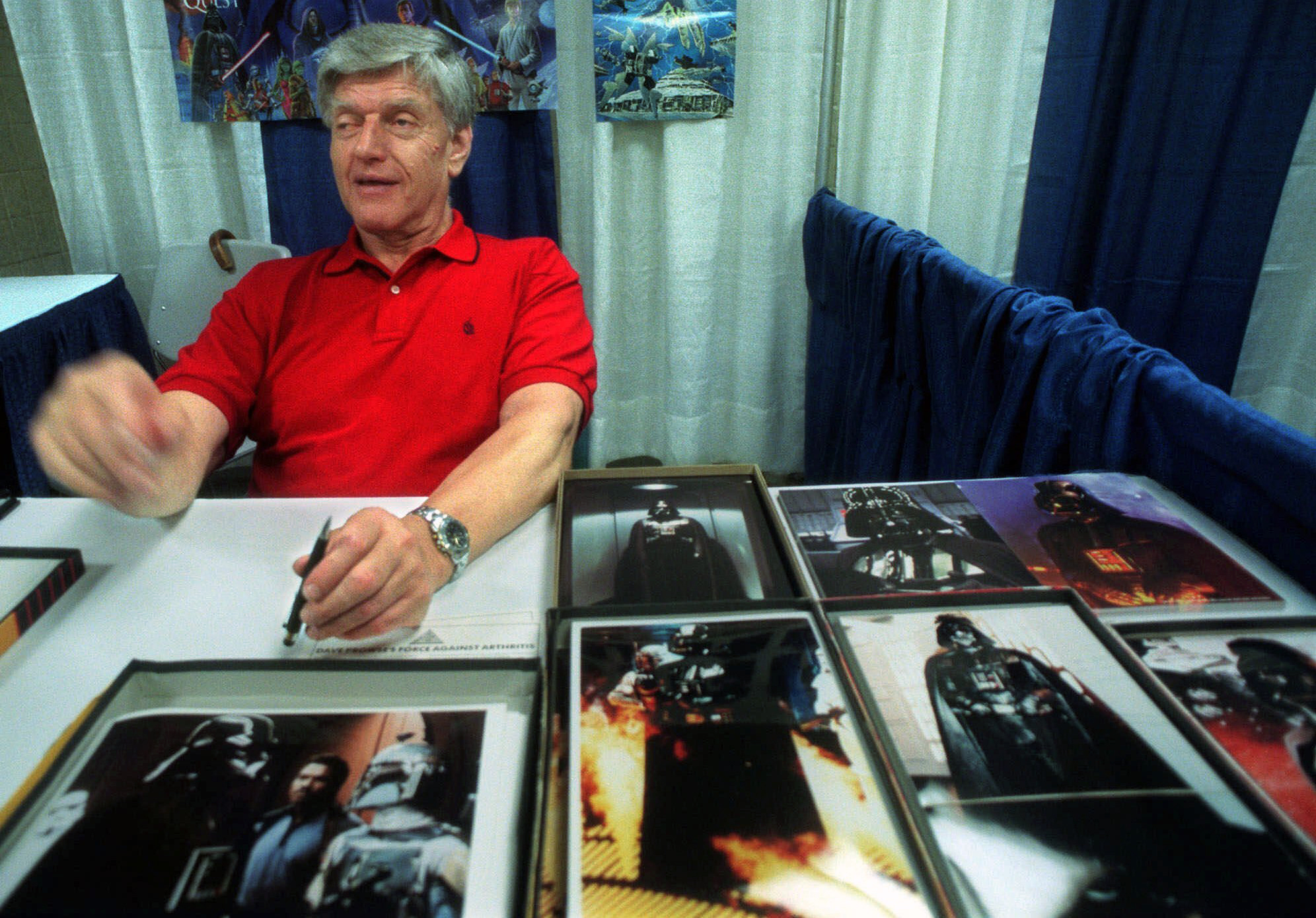 In this file photo dated Friday, May 7, 1999, Dave Prowse, the original Darth Vader from the "Star Wars Trilogy," poses during the New York Comic and Fantasy Creators Convention. (AP Photo/Lynsey Addario, FILE)