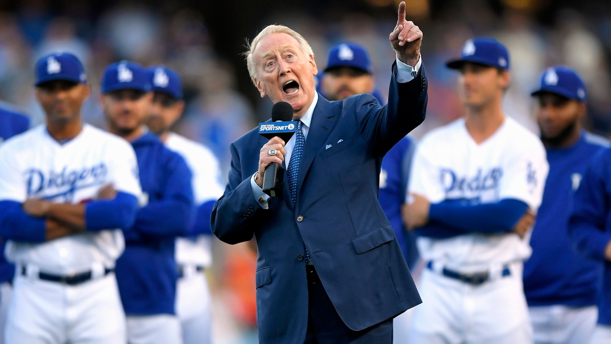 In this May 3, 2017, file photo, Los Angeles Dodgers broadcaster Vin Scully speaks during his induction into the team's Ring of Honor prior to a baseball game between the Dodgers and the San Francisco Giants, in Los Angeles. (AP Photo/Mark J. Terrill, File)