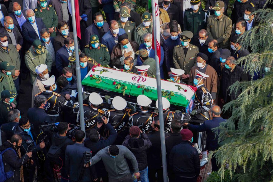 In this photo released by the official website of the Iranian Defense Ministry, military personnel carry the flag draped coffin of Mohsen Fakhrizadeh, a scientist who was killed on Friday. (Iranian Defense Ministry via AP)