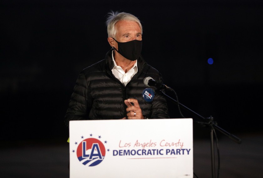 George Gascón, candidate for Los Angeles District Attorney, speaks during a drive-in election night watch party at the LA Zoo parking lot on Nov. 3, 2020. (Myung J. Chun/Los Angeles Times)