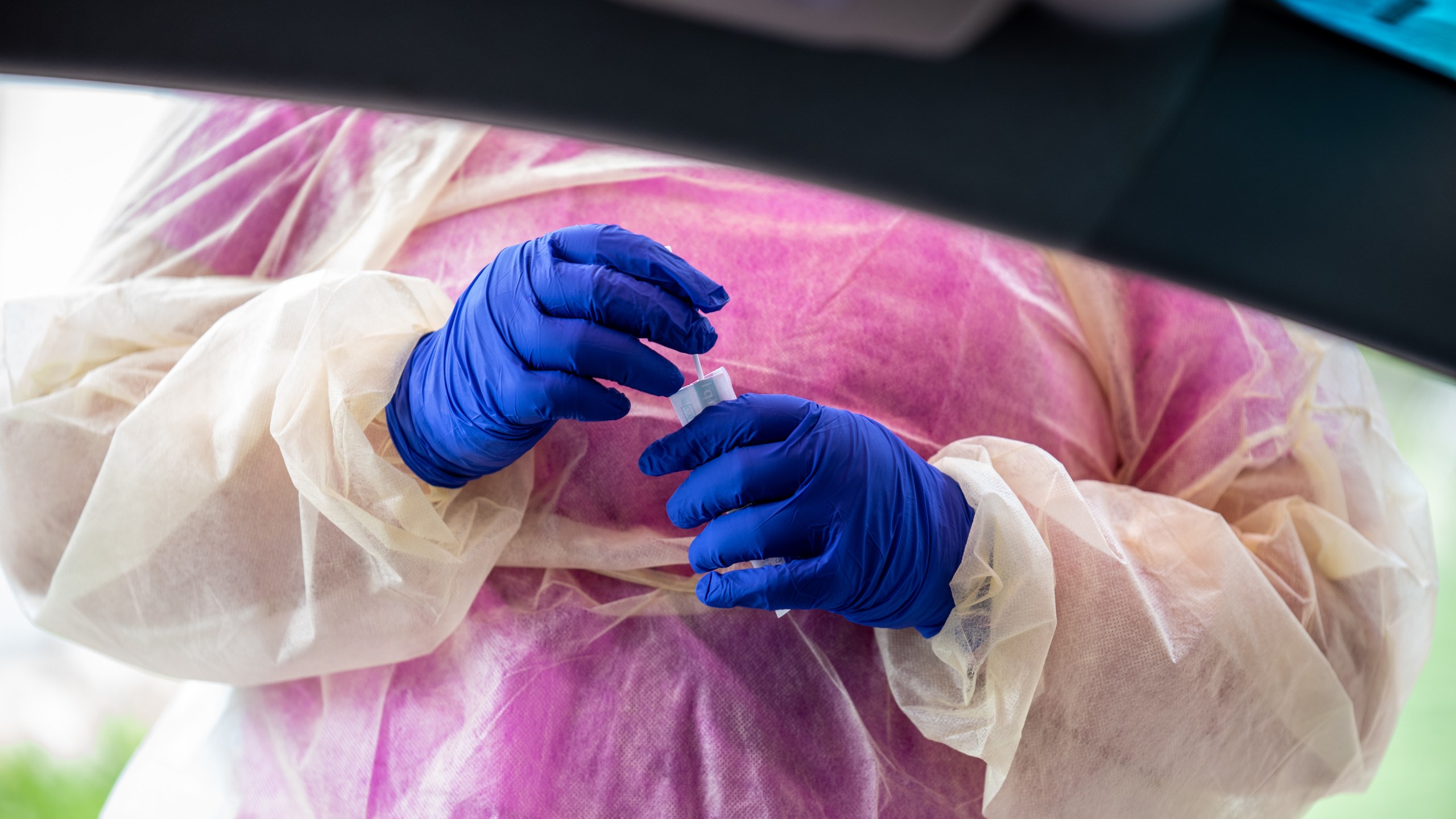 A nurse prepares to swab a patient at a coronavirus testing center in this file photo from July 7, 2020 in Austin, Texas. (Sergio Flores/Getty Images)