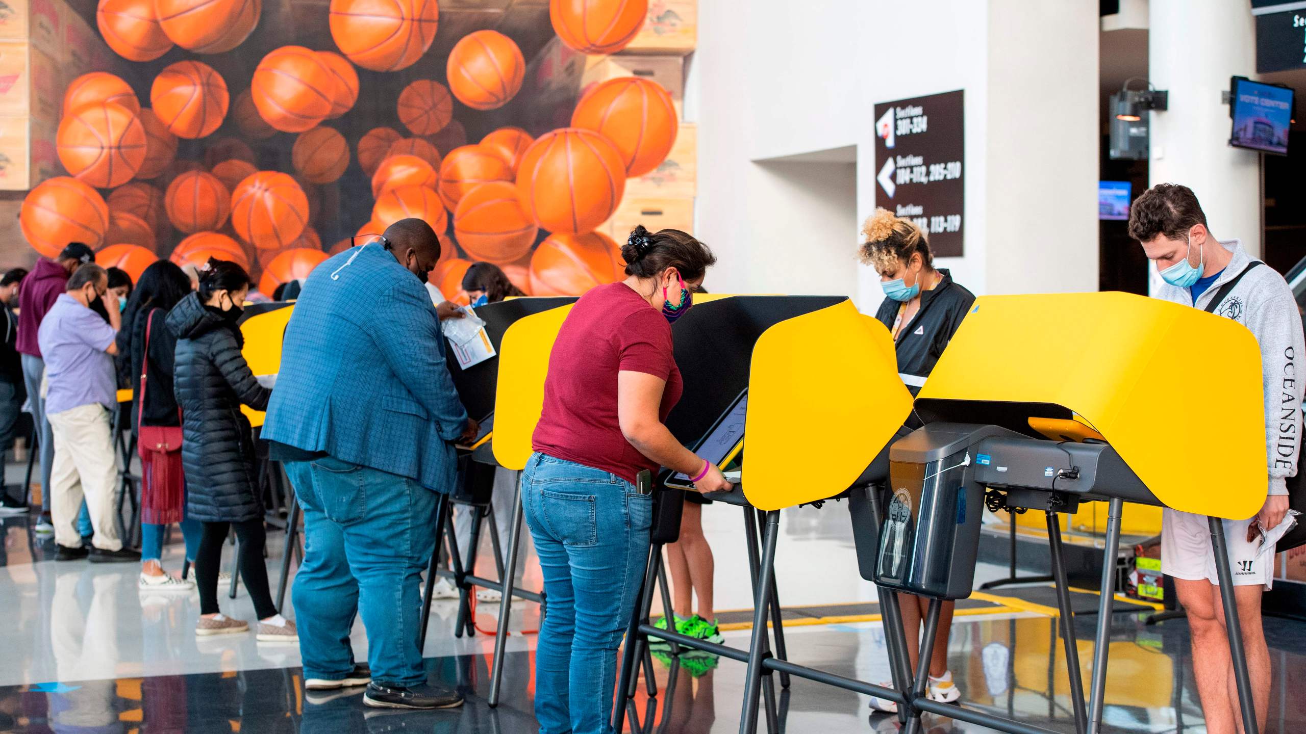 People vote at the Staples Center on Nov. 3, 2020. (Valerie Macon / AFP / Getty Images)