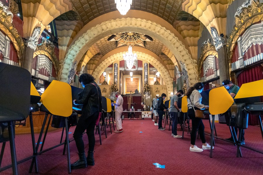 People vote inside the historic Hollywood Pantages Theatre in Los Angeles on Nov. 3, 2020. (David McNew / Getty Images)