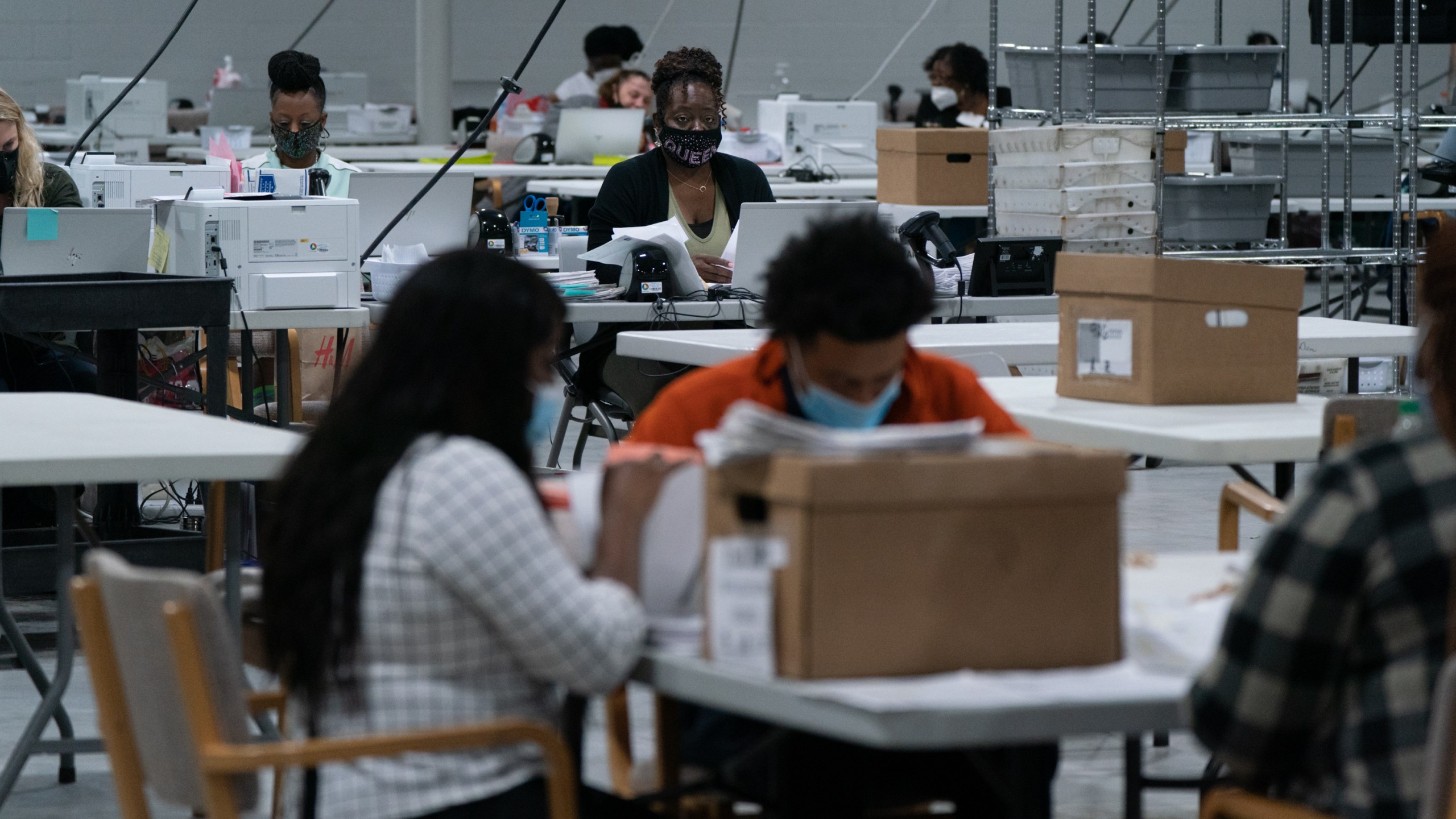 Election personnel sort ballots in preparation for an audit at the Gwinnett County Board of Voter Registrations and Elections offices on Nov. 7, 2020, in Lawrenceville, Georgia. (Elijah Nouvelage/Getty Images)