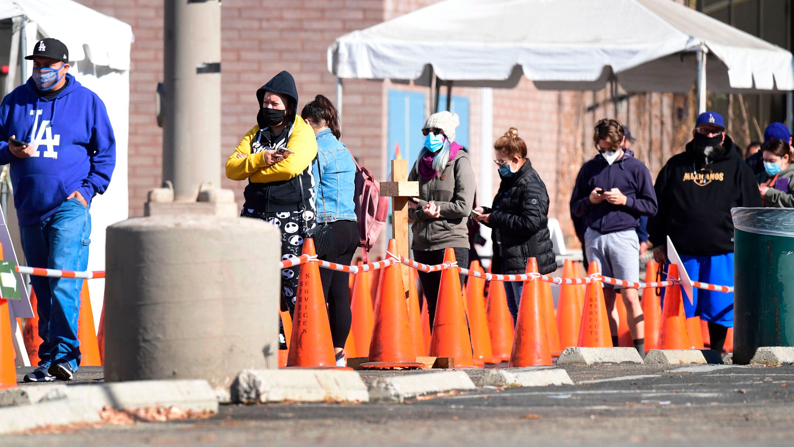 People wait in line to be tested at a coronavirus test site in Los Angeles on Nov. 10, 2020. (FREDERIC J. BROWN/AFP via Getty Images)