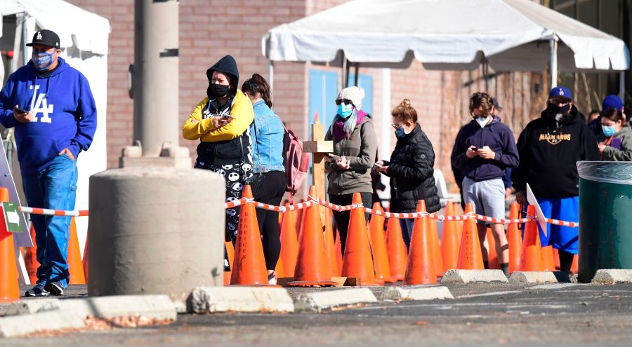 People wait in line to be tested at a coronavirus test site in Los Angeles on Nov. 10, 2020. (FREDERIC J. BROWN/AFP via Getty Images)