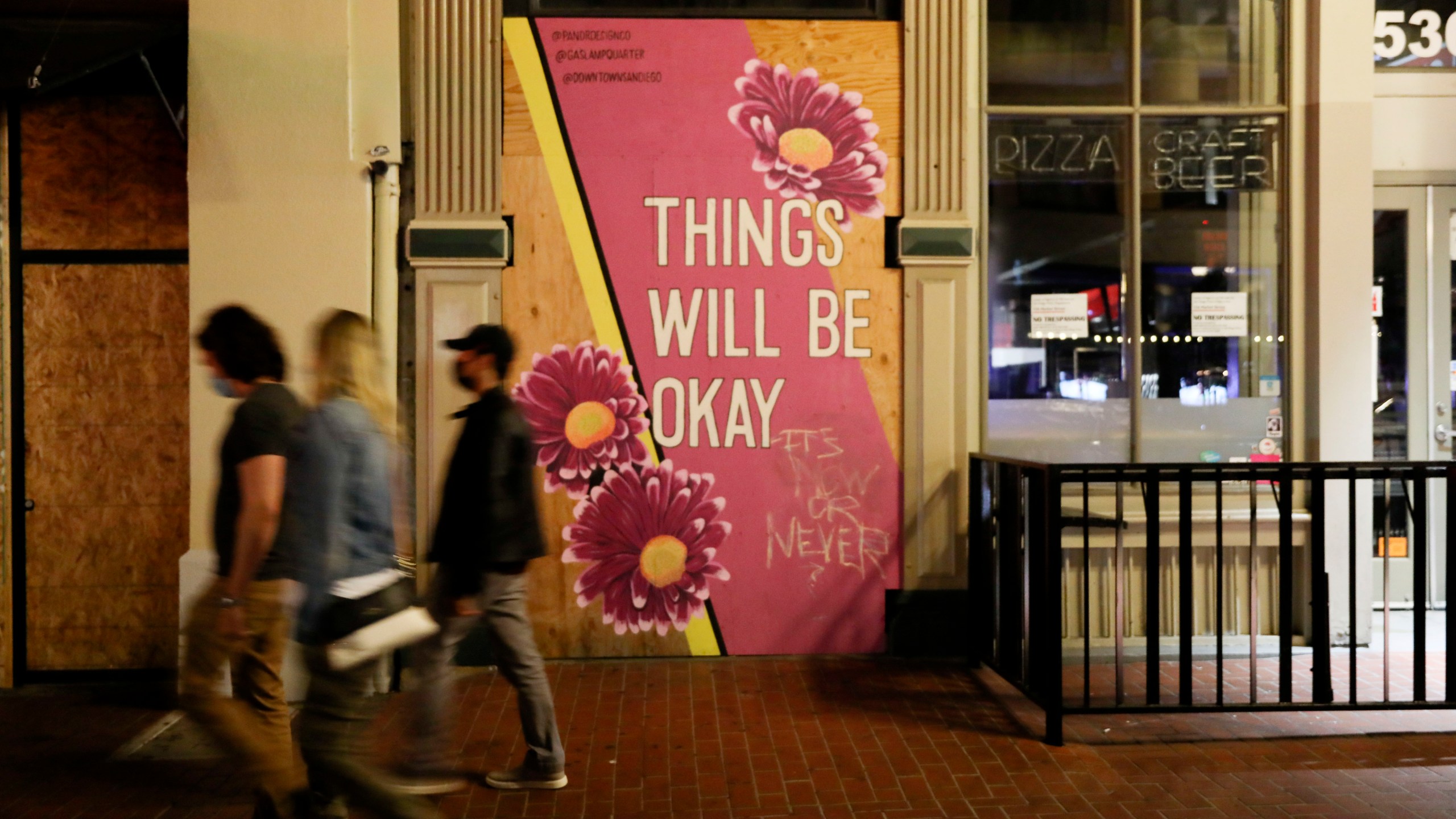 A general view of Market Street in the Gaslamp Quarter before an imposed curfew on November 21, 2020 in San Diego, California. (Sandy Huffaker/Getty Images) A general view of Market Street in the Gaslamp Quarter before an imposed curfew on November 21, 2020 in San Diego, California. (Sandy Huffaker/Getty Images)