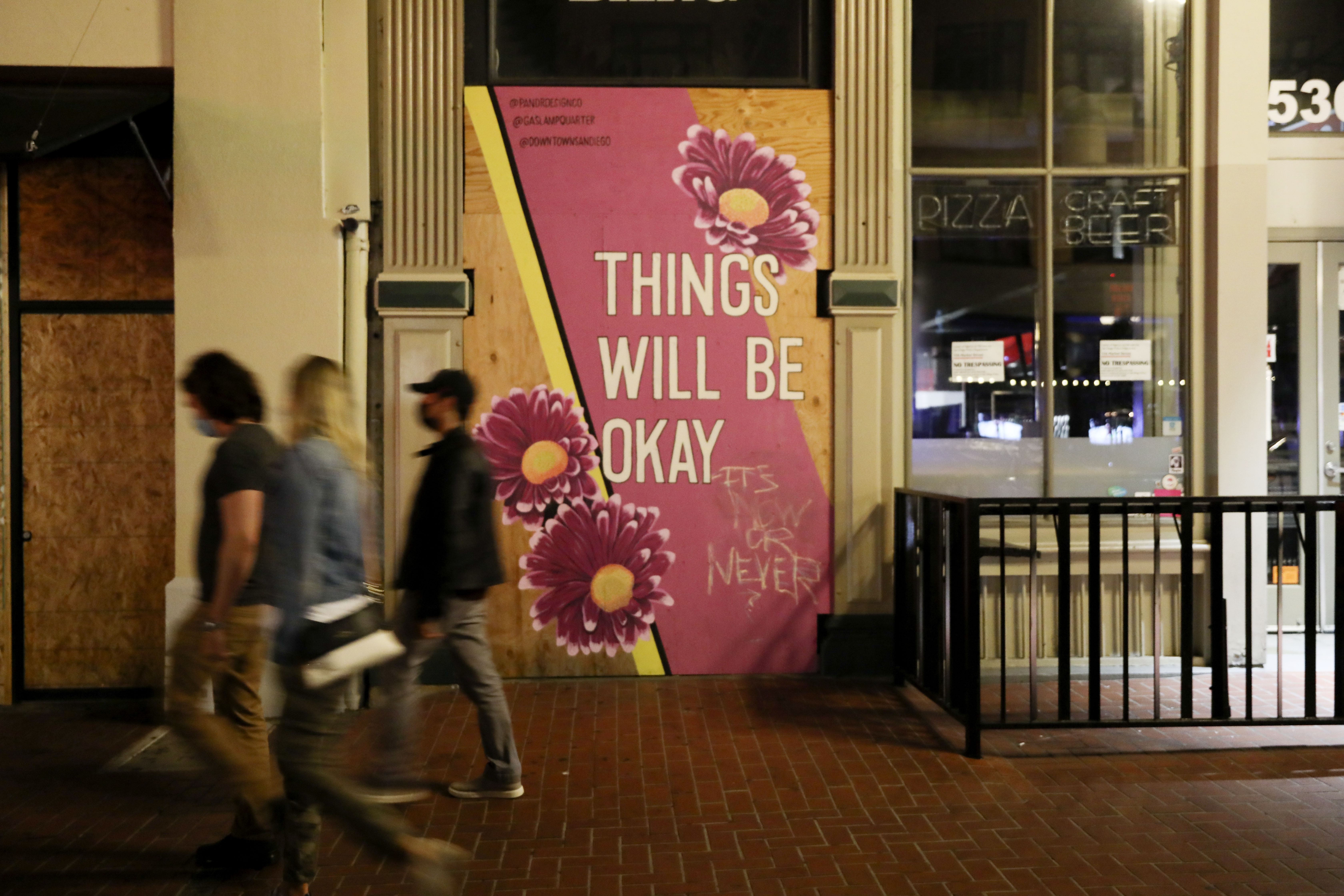 A general view of Market Street in the Gaslamp Quarter before an imposed curfew on November 21, 2020 in San Diego, California. (Sandy Huffaker/Getty Images) A general view of Market Street in the Gaslamp Quarter before an imposed curfew on November 21, 2020 in San Diego, California. (Sandy Huffaker/Getty Images)