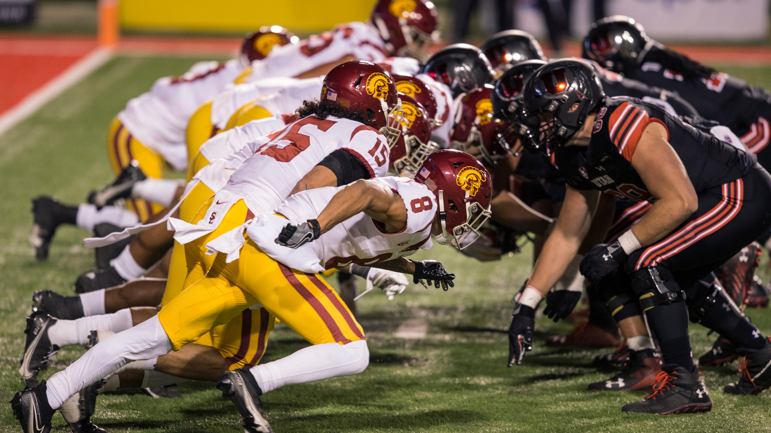 The lines of the Utah Utes and the USC Trojans clash after a snap during their game November 21, 2020 at Rice Eccles Stadium in Logan, Utah. (Chris Gardner/Getty Images)