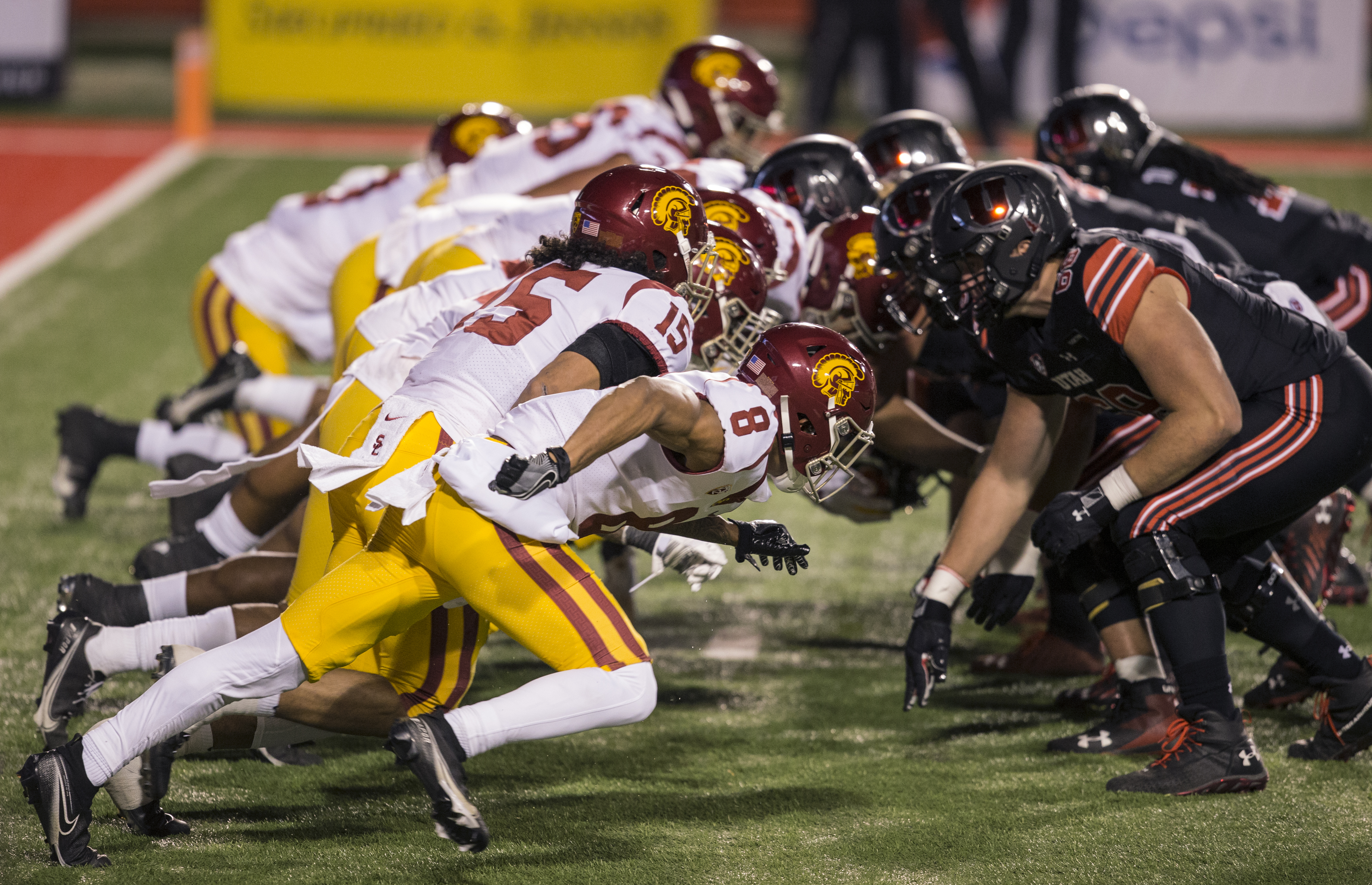 The lines of the Utah Utes and the USC Trojans clash after a snap during their game November 21, 2020 at Rice Eccles Stadium in Logan, Utah. (Chris Gardner/Getty Images)