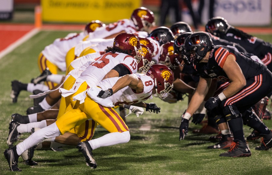 The lines of the Utah Utes and the USC Trojans clash after a snap during their game November 21, 2020 at Rice Eccles Stadium in Logan, Utah. (Chris Gardner/Getty Images)