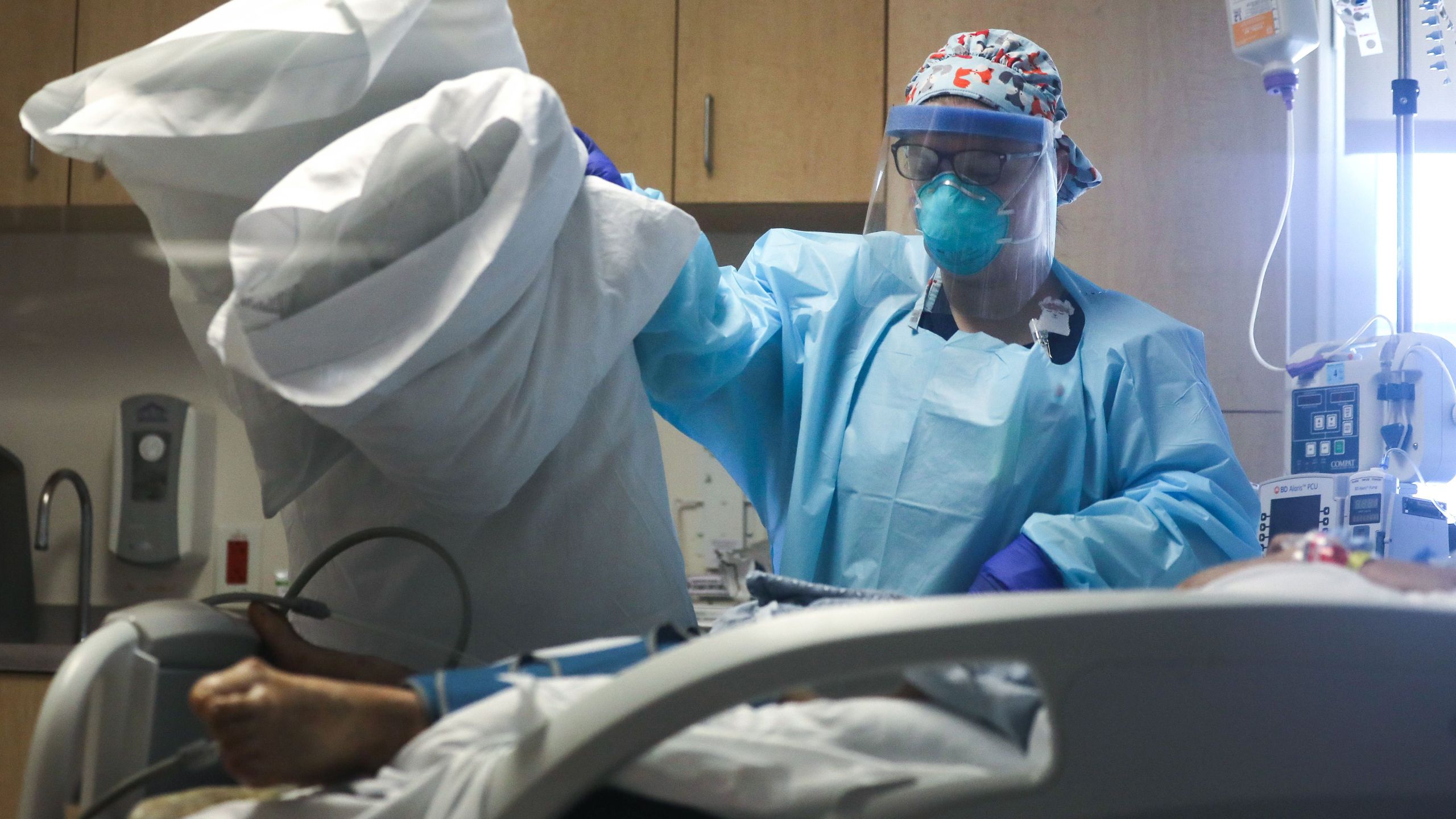 A nurse cares for a COVID-19 patient in the Intensive Care Unit (ICU) at El Centro Regional Medical Center in hard-hit Imperial County on July 28, 2020 in El Centro, California. ( Mario Tama/Getty Images)