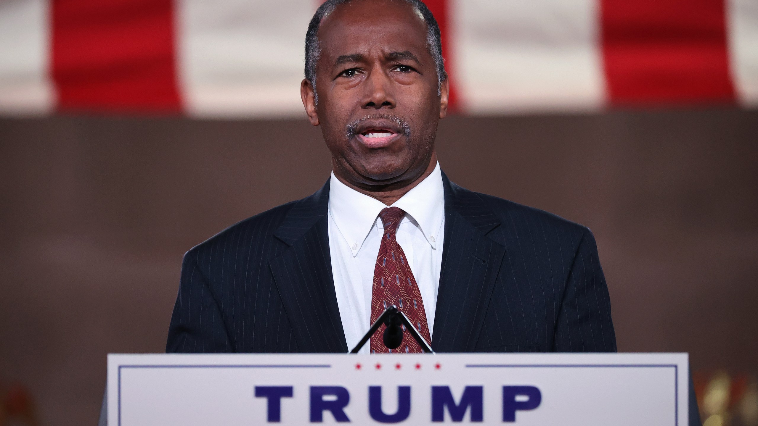 In a prerecorded address for the Republican National Convention released August 27, 2020, Housing and Urban Development Secretary Ben Carson speaks inside an empty Mellon Auditorium August 26, 2020 in Washington, DC. (Chip Somodevilla/Getty Images)