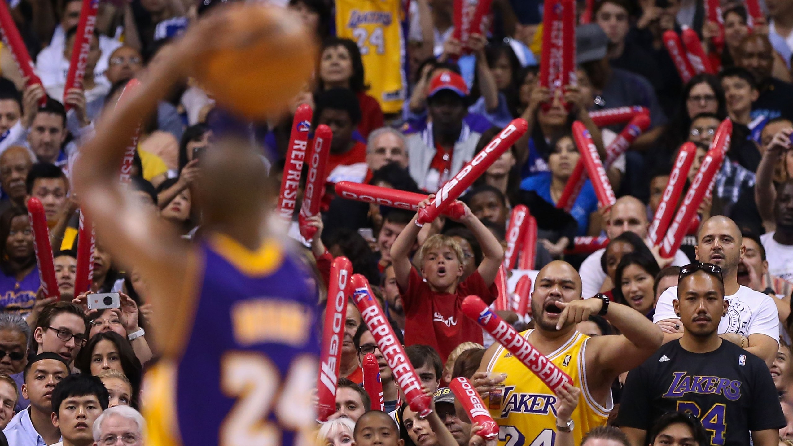 Fans of the Los Angeles Lakers and Los Angeles Clippers cheer as Kobe Bryant #24 takes a free throw shot during the NBA game at Staples Center on April 7, 2013 in Los Angeles, California. (Christian Petersen/Getty Images)