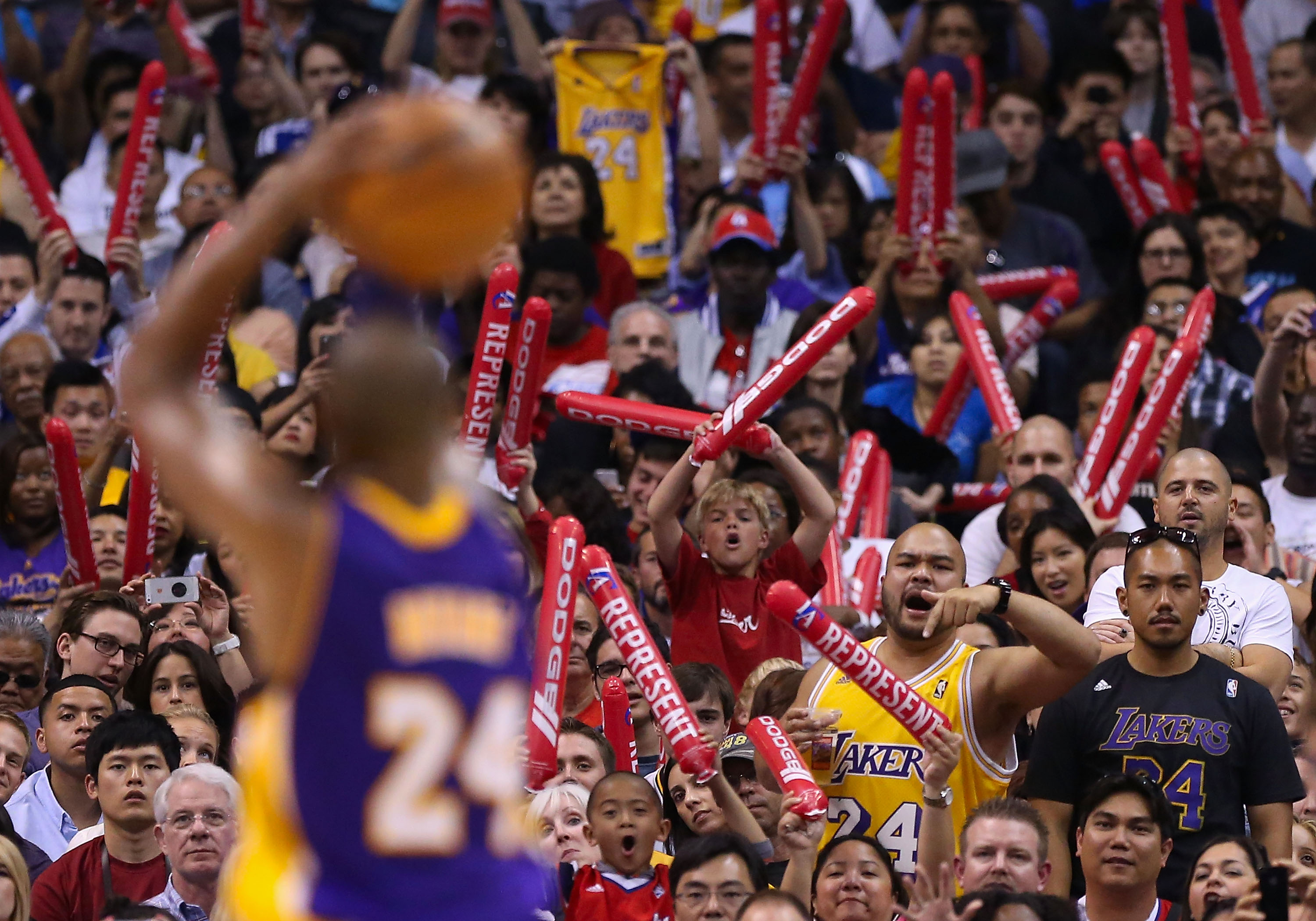 Fans of the Los Angeles Lakers and Los Angeles Clippers cheer as Kobe Bryant #24 takes a free throw shot during the NBA game at Staples Center on April 7, 2013 in Los Angeles, California. (Christian Petersen/Getty Images)