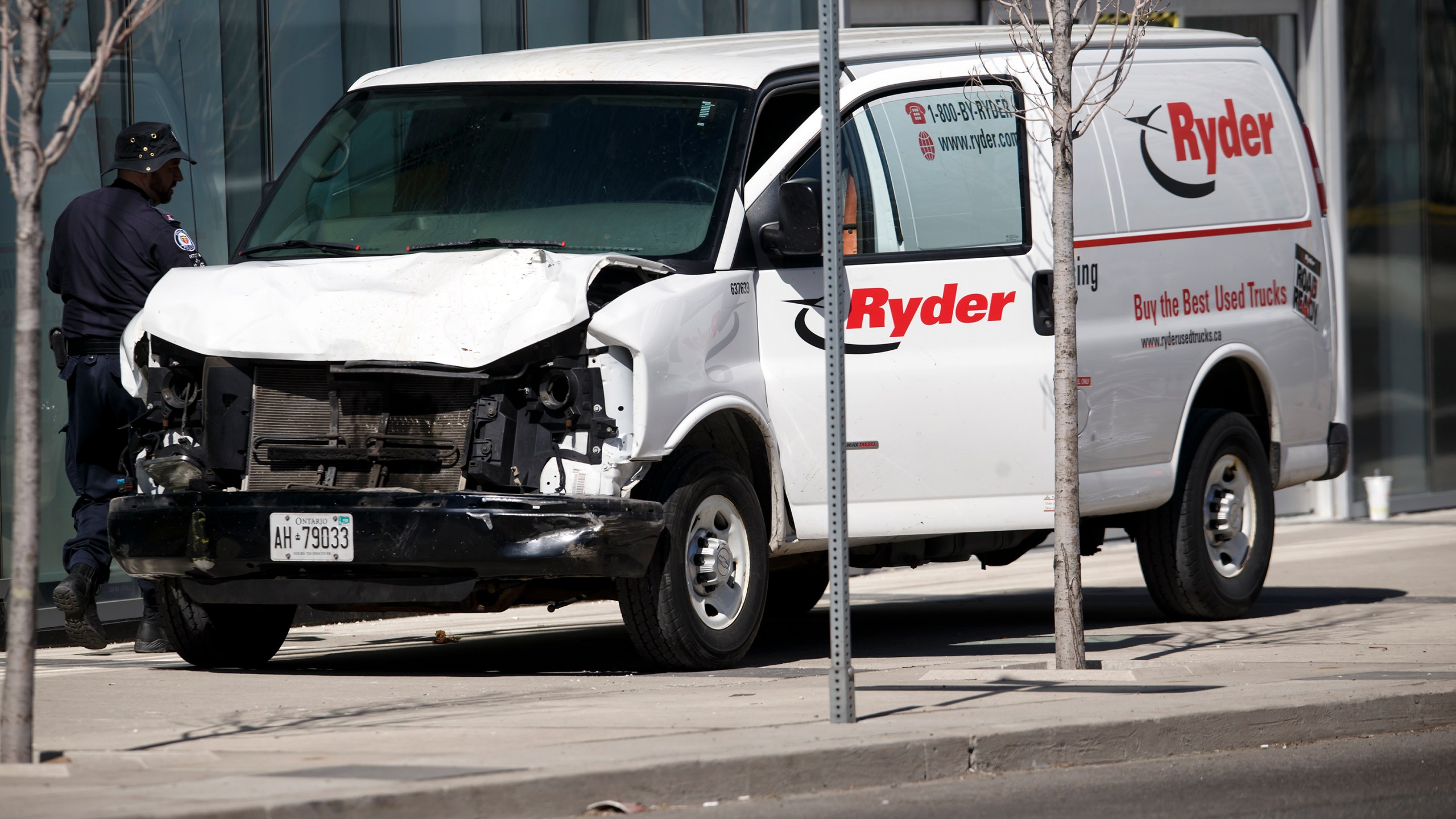 Police inspect a van suspected of being involved in a crash that injured multiple pedestrians on April 23, 2018 in Toronto, Canada. (Cole Burston/Getty Images)