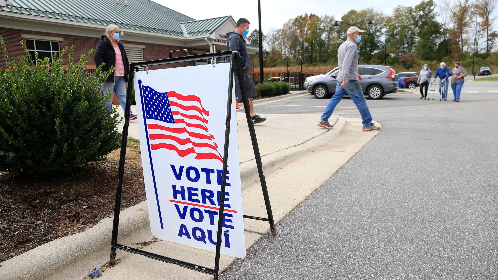 Voters arrive and depart a polling place on Oct.31, 2020 in Yadkinville, North Carolina. (Photo by Brian Blanco/Getty Images)