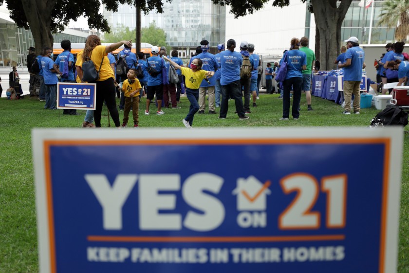 People attend a September 2020 rally in Los Angeles in support of a rent control ballot initiative. (Myung J. Chun / Los Angeles Times)