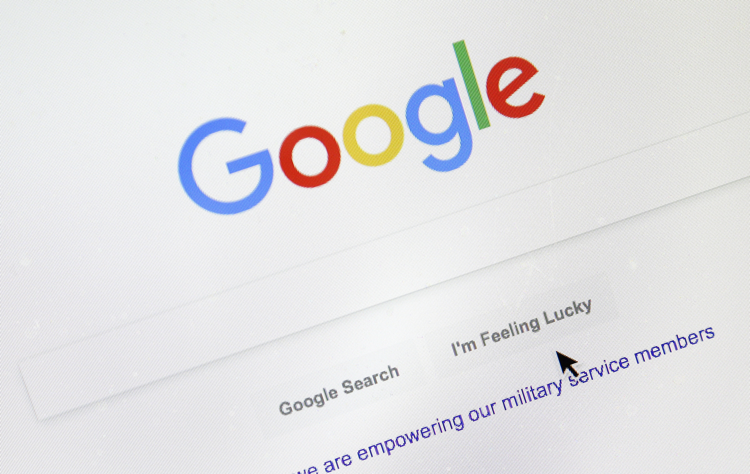 In this Aug. 28, 2018, file photo, a cursor moves over Google's search engine page, in Portland, Ore. (AP Photo/Don Ryan, File)