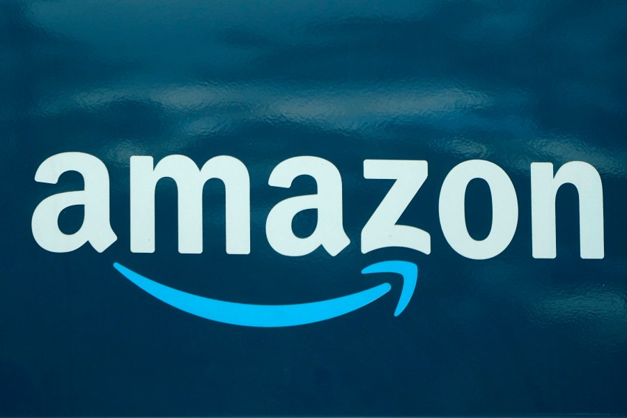 In this Oct. 1, 2020 file photo, an Amazon logo appears on an Amazon delivery van, in Boston. Amazon opened an online pharmacy Tuesday, Nov. 17 giving shoppers the chance to buy their medication and order refills on their phones and computers and have it delivered to their doorsteps in a couple of days. (AP Photo/Steven Senne, File)