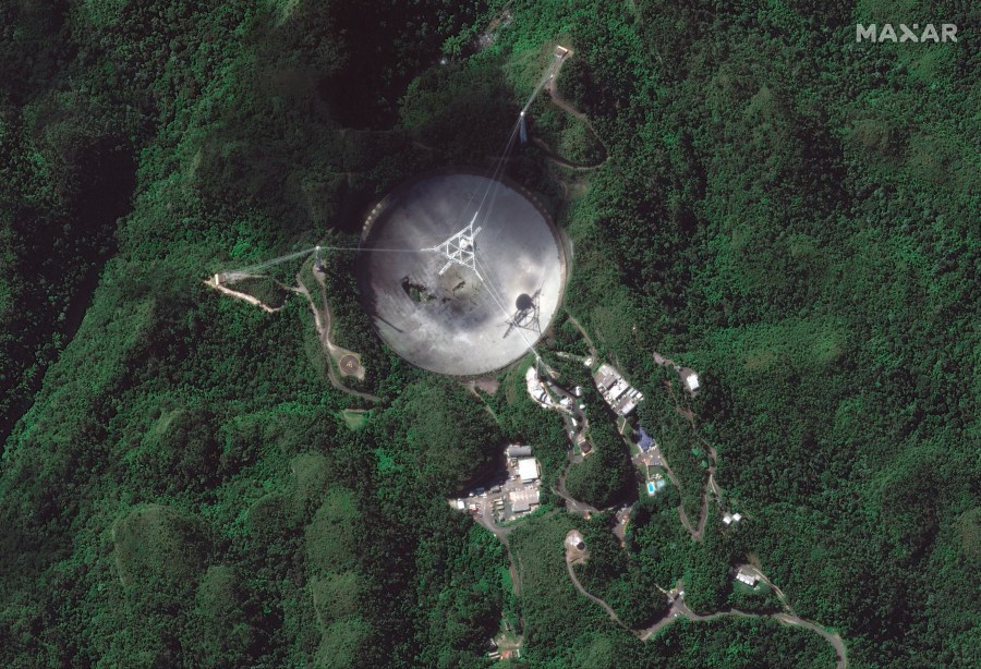 This satellite image provided by 2020 Maxar Technologies shows the damaged radio telescope at the Arecibo Observatory in Puerto Rico, Thursday, Nov. 17, 2020. (Satellite image ©2020 Maxar Technologies via AP)