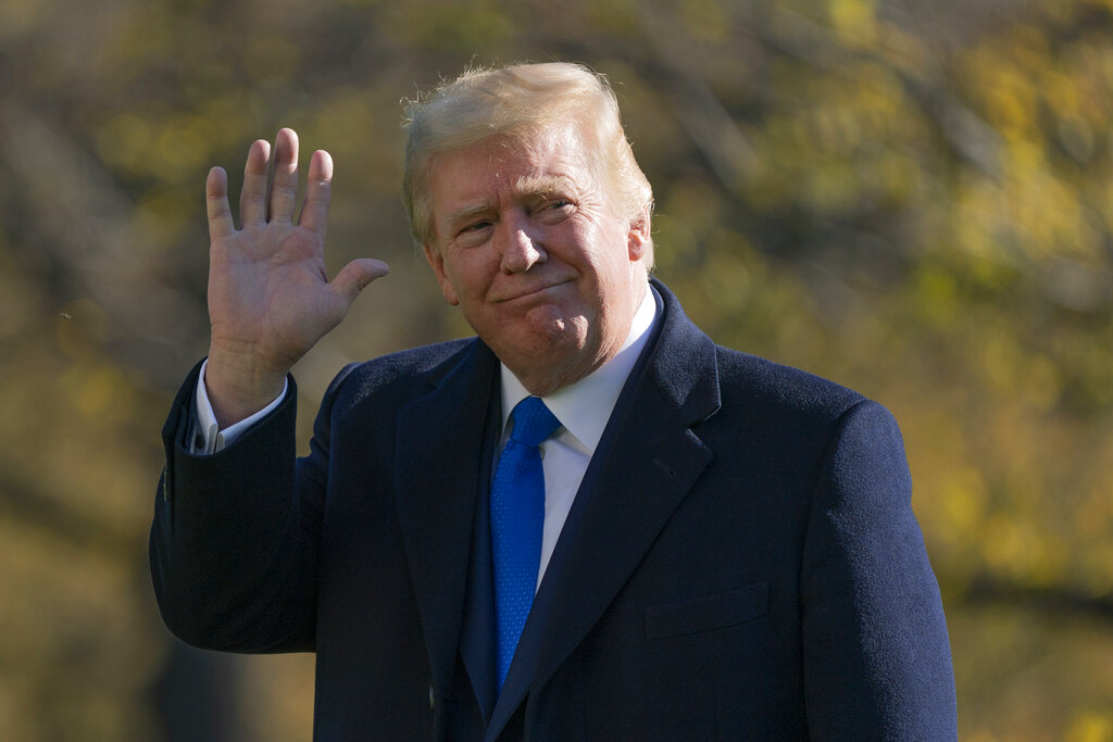 President Donald Trump walks on the South Lawn of the White House in Washington, Sunday, Nov. 29, 2020, after stepping off Marine One. (AP Photo/Patrick Semansky)