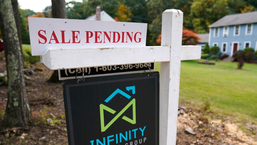 In this Sept. 29, 2020 file photo, a sale pending sign is displayed outside a residential home for sale in East Derry, N.H. (AP Photo/Charles Krupa, File)