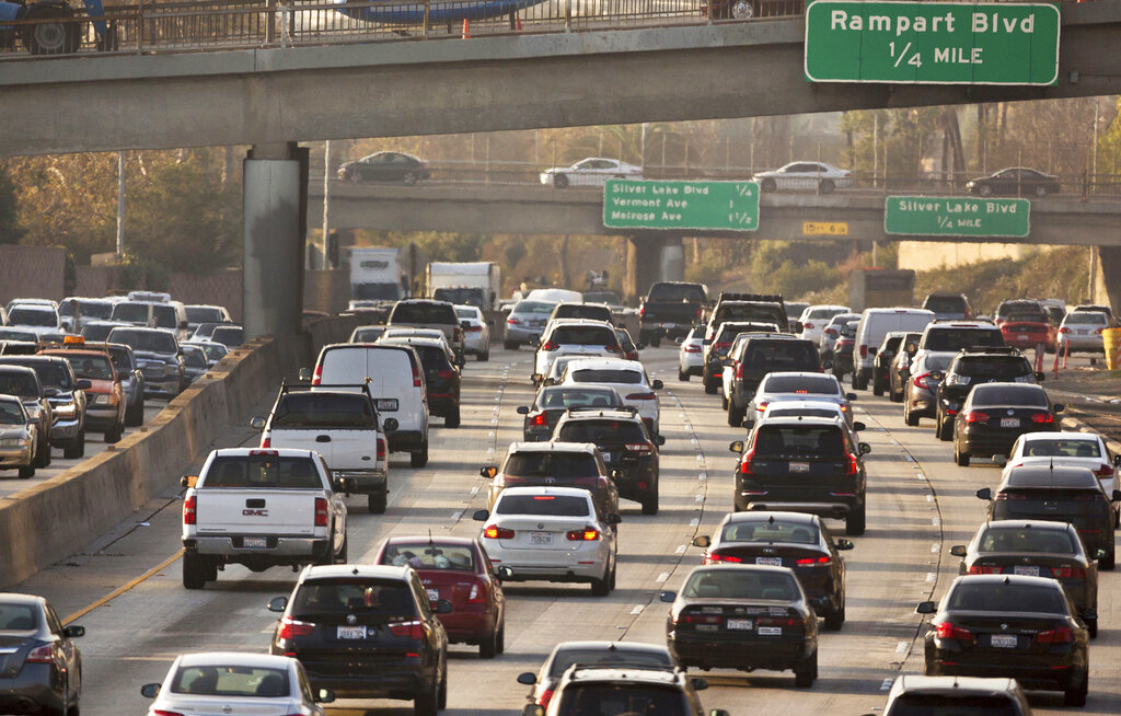 In this Dec. 12, 2018, file photo, traffic moves along the Hollywood Freeway in Los Angeles. (AP Photo/Damian Dovarganes, File)